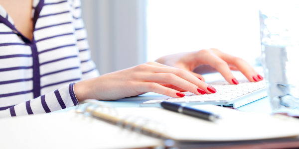Certificate III in Business women typing with hands